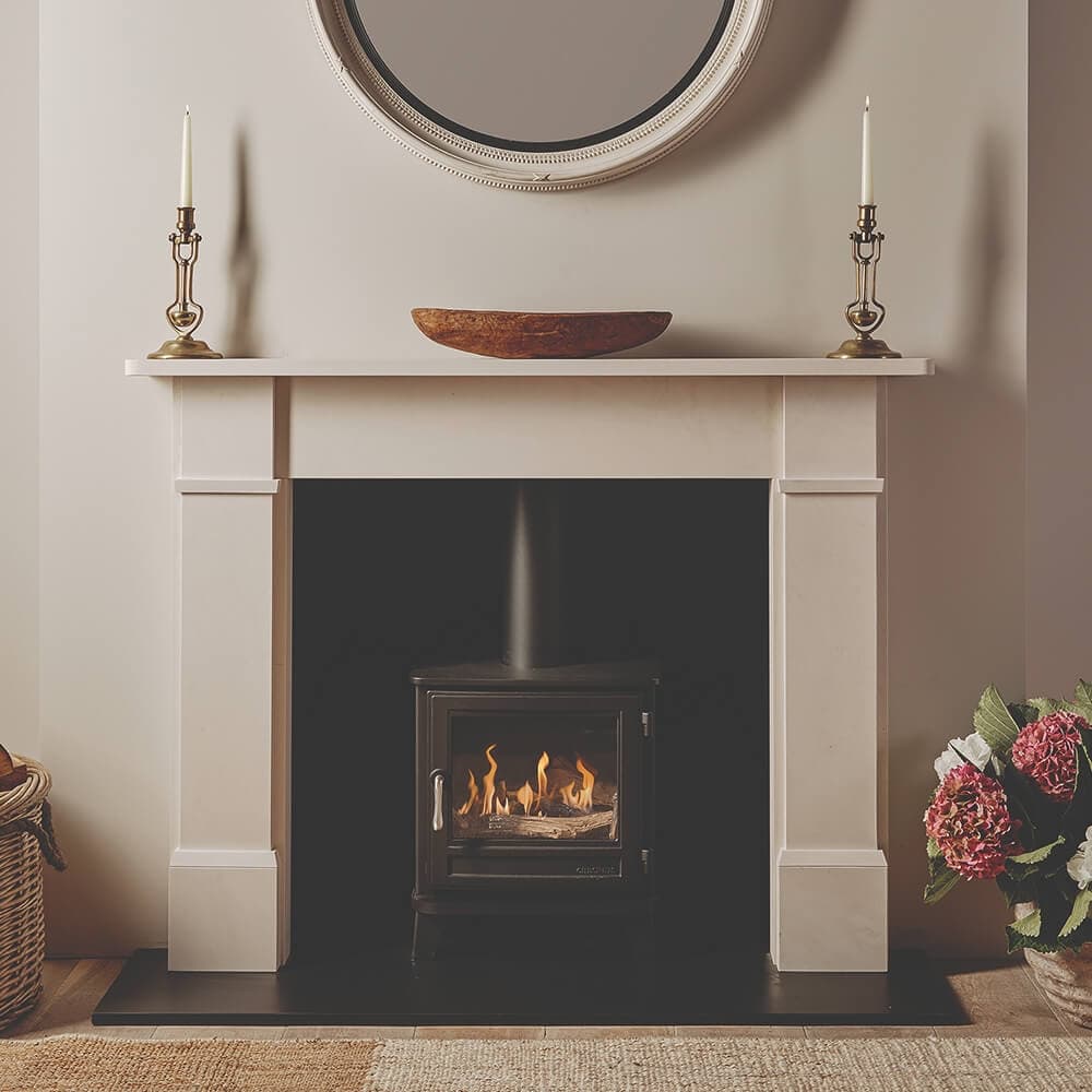 Bioethanol fire within a white mantel fireplace