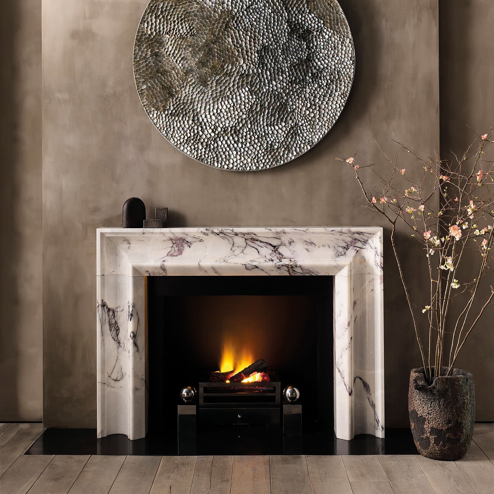 Bespoke veined marble fireplace surround in a contemporary living room